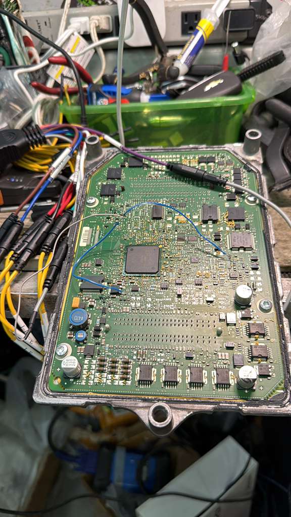 ECM circuit board with direct EEPROM programming wires attached — Prestige Mobile Locksmith Austin TX