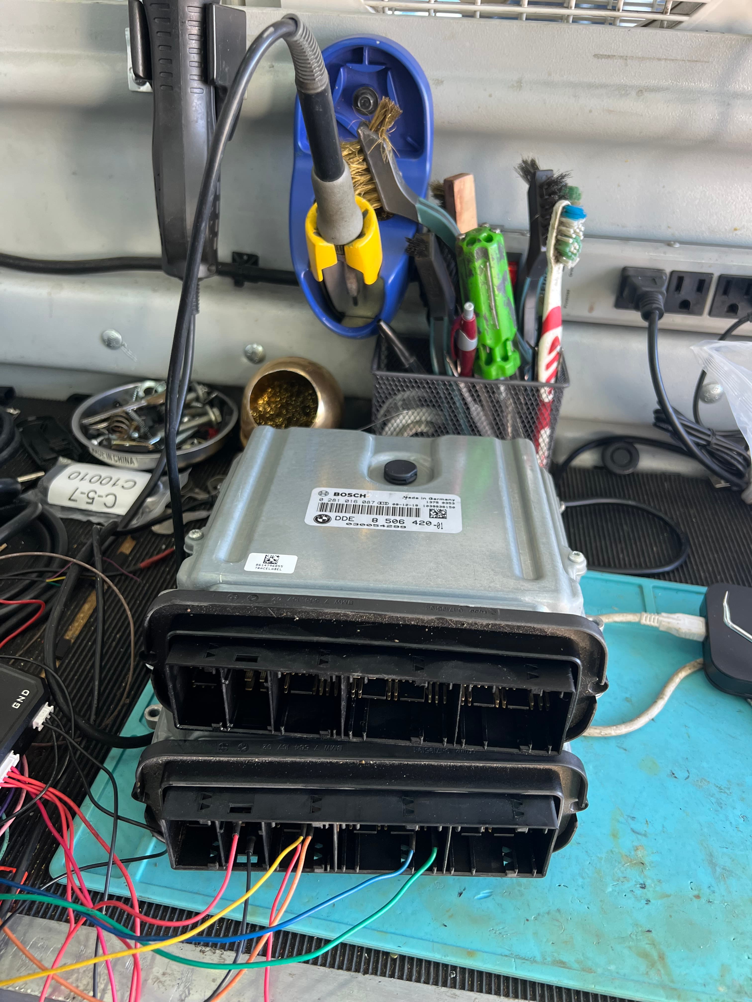 ECM and PCM automotive control modules on programming workbench — Prestige Mobile Locksmith Austin TX